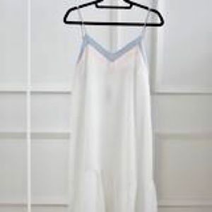 White summer dress with pink and blue details